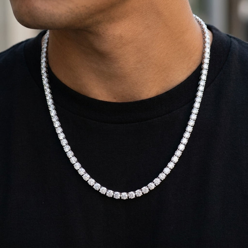 Cubic zirconia tennis necklace worn by a man over a black t-shirt, showing the length on the chest