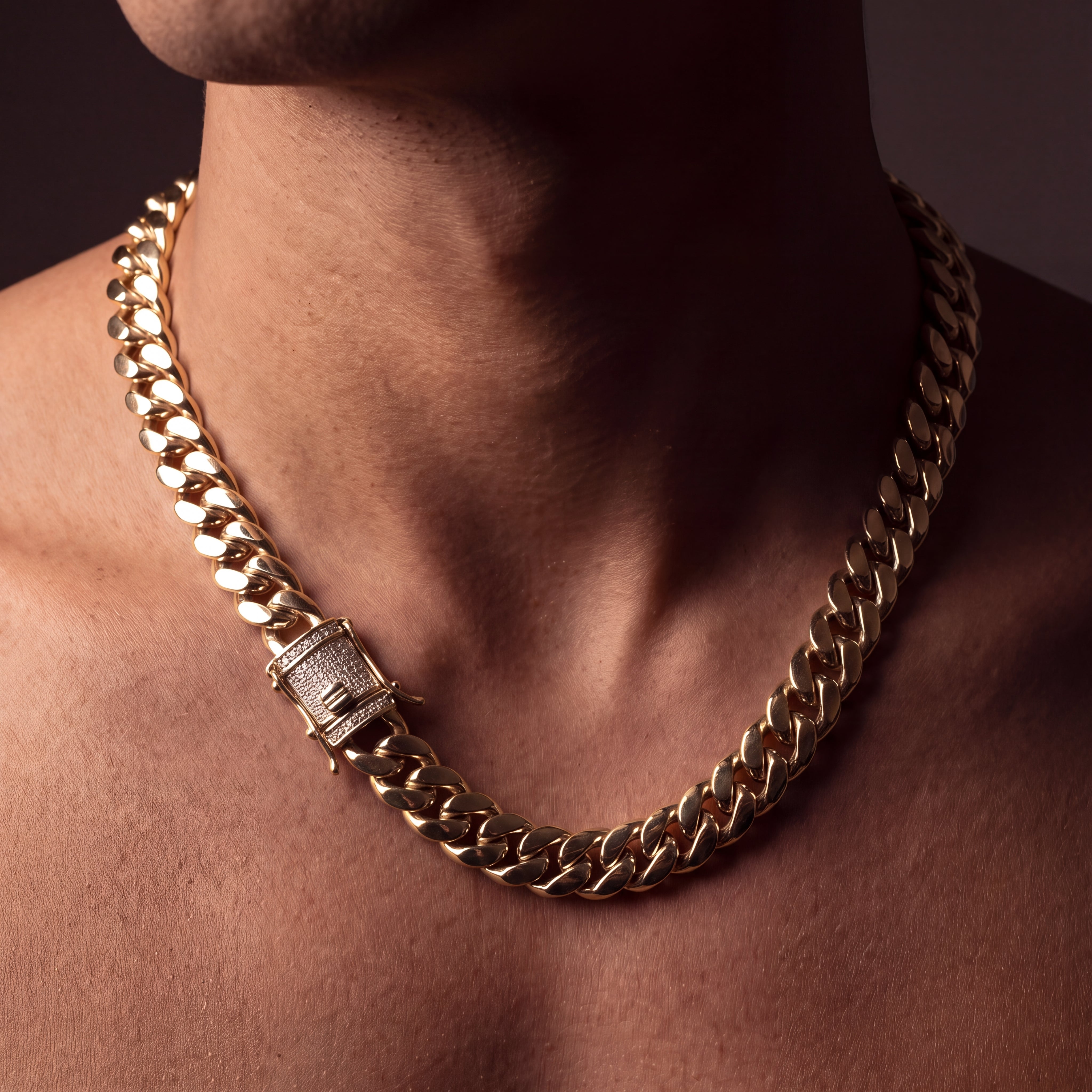 Iced lock box clasp on an 18K gold plated Miami Cuban chain, pave cubic zirconia face