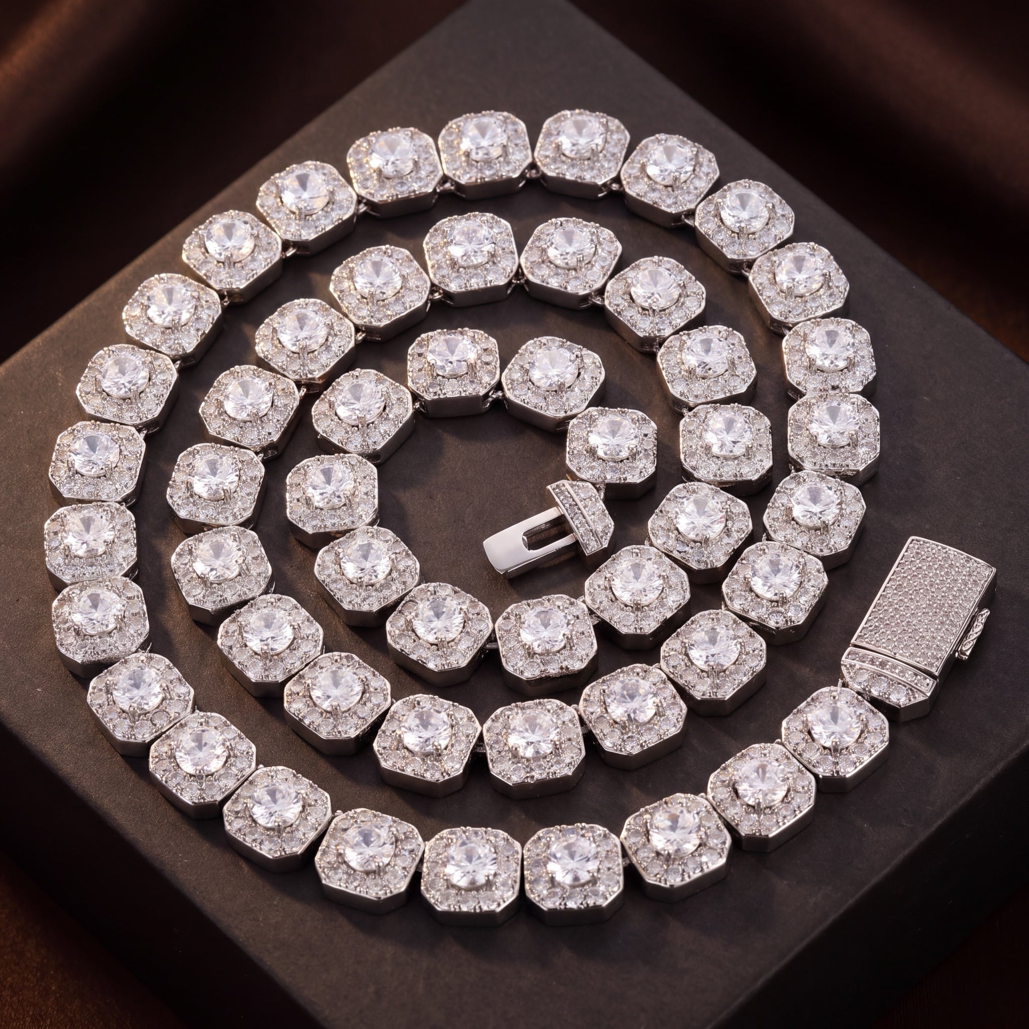 Clustered tennis chain laid out on a dark surface