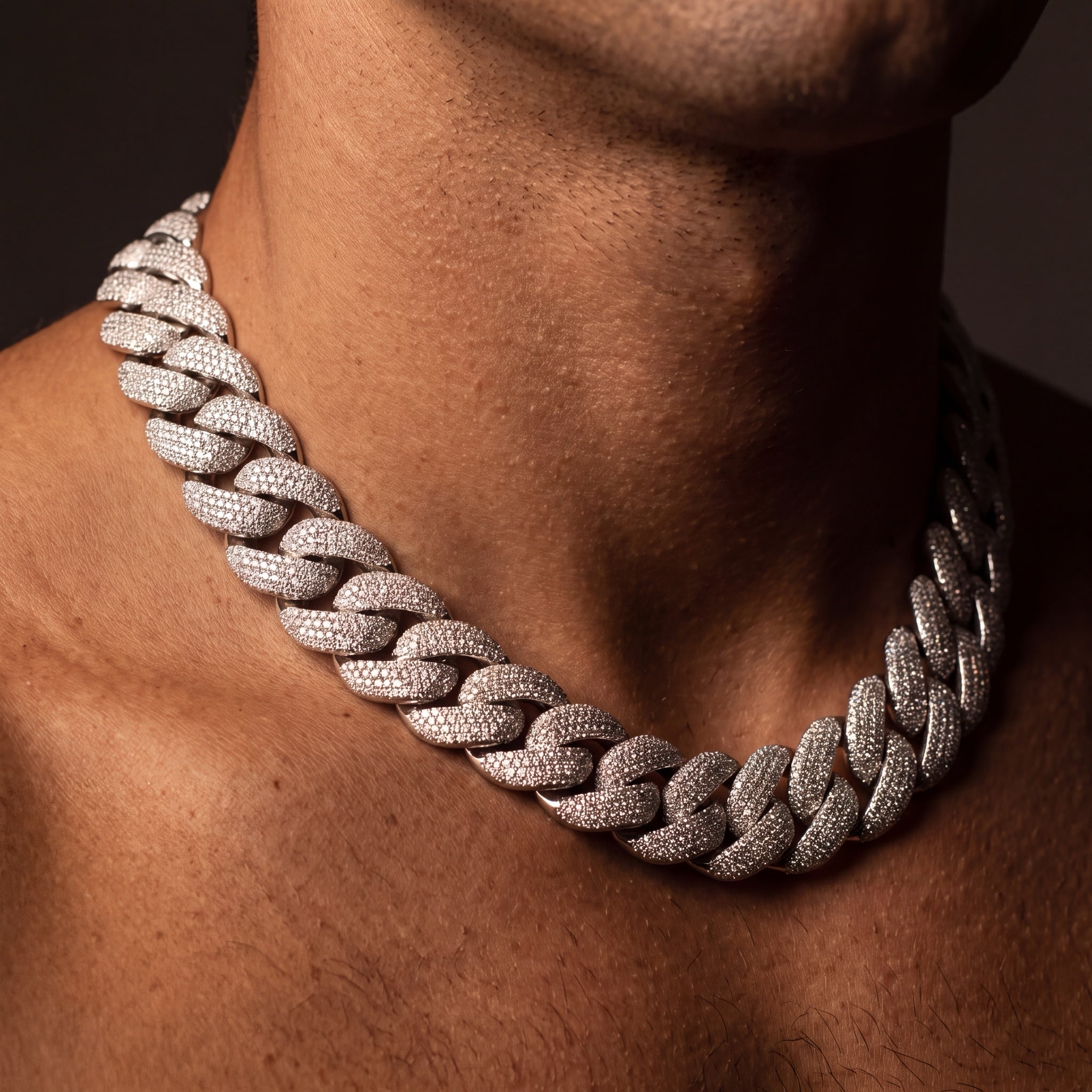 24 mm chunky iced Cuban link chain worn on a man's neck