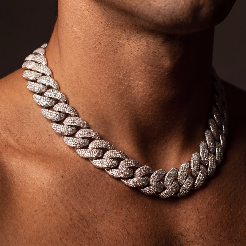 24 mm chunky iced Cuban link chain worn on a man's neck