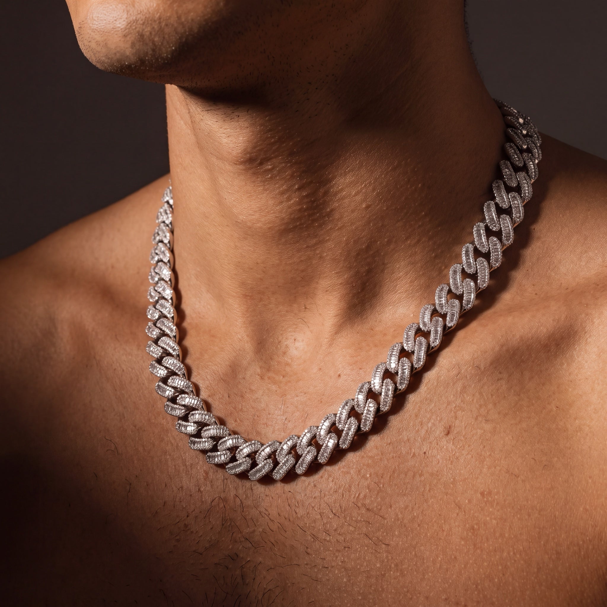 15 mm baguette iced Cuban link chain worn on a man's neck
