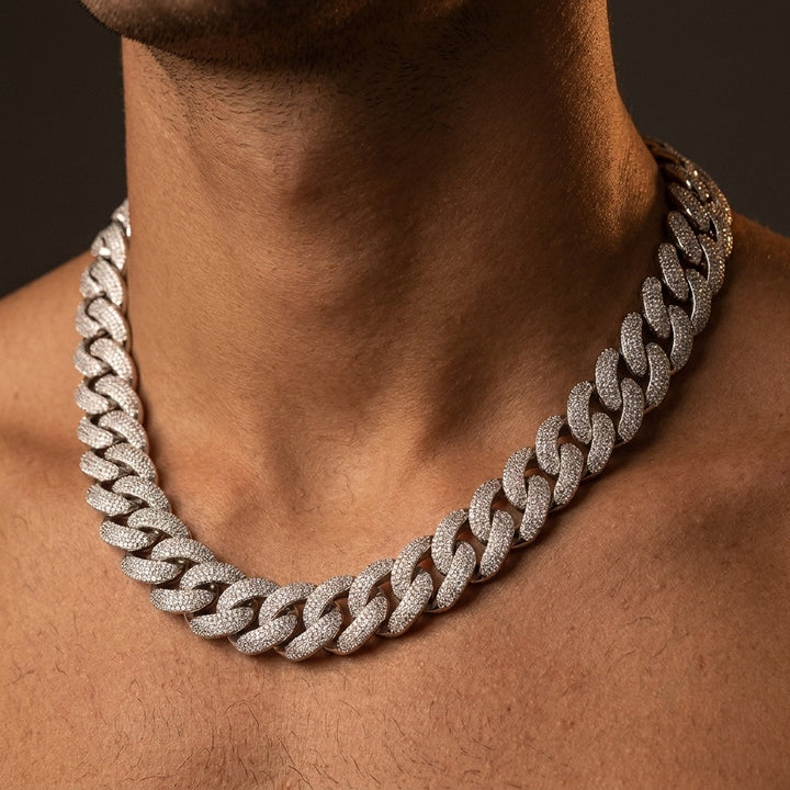 Chunky 20 mm iced out Cuban link chain photographed against a dark background