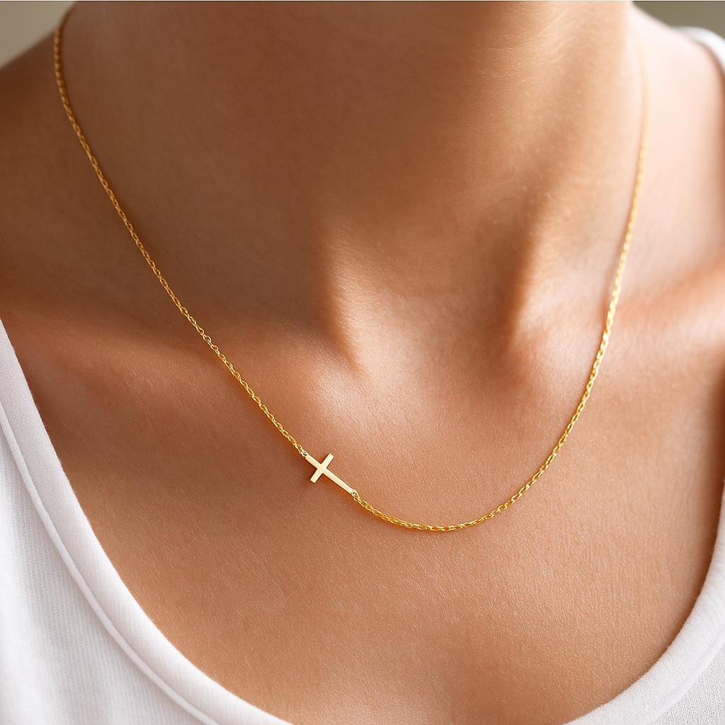 Minimalist gold cross pendant on fine chain