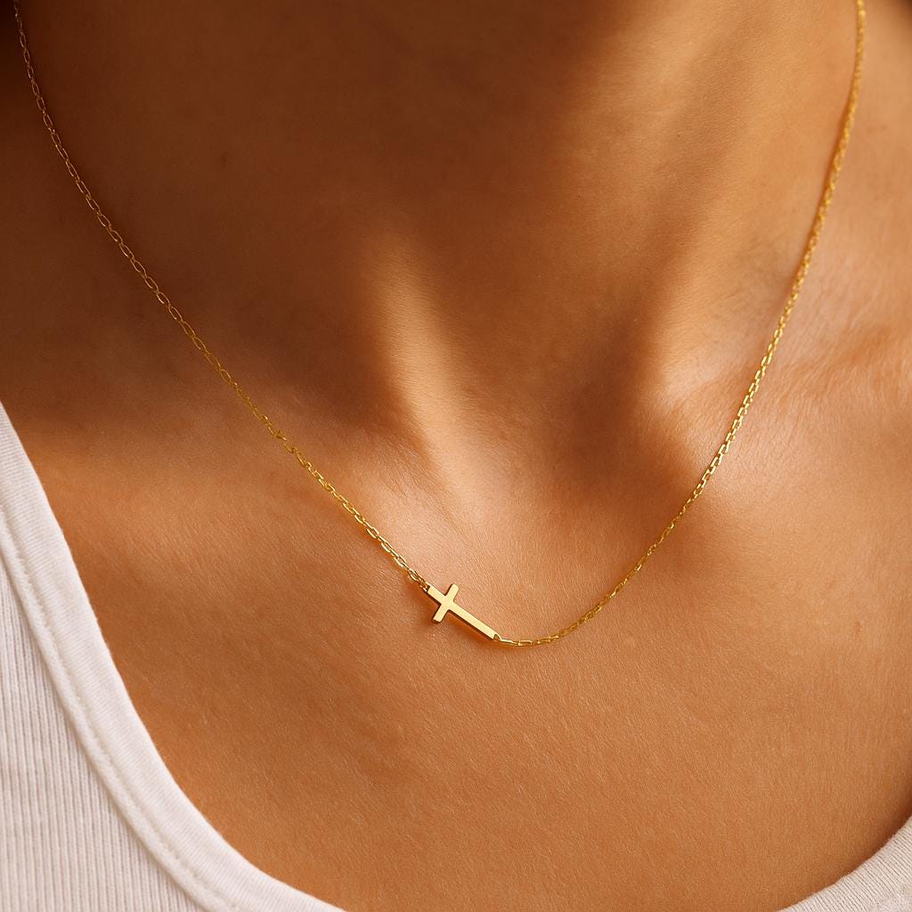 Dainty gold sideways cross necklace in stainless steel