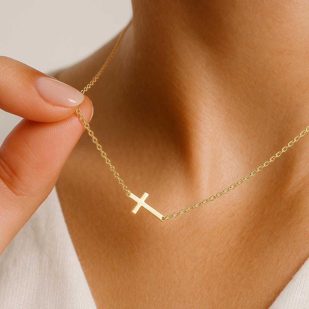 Dainty gold sideways cross necklace in stainless steel